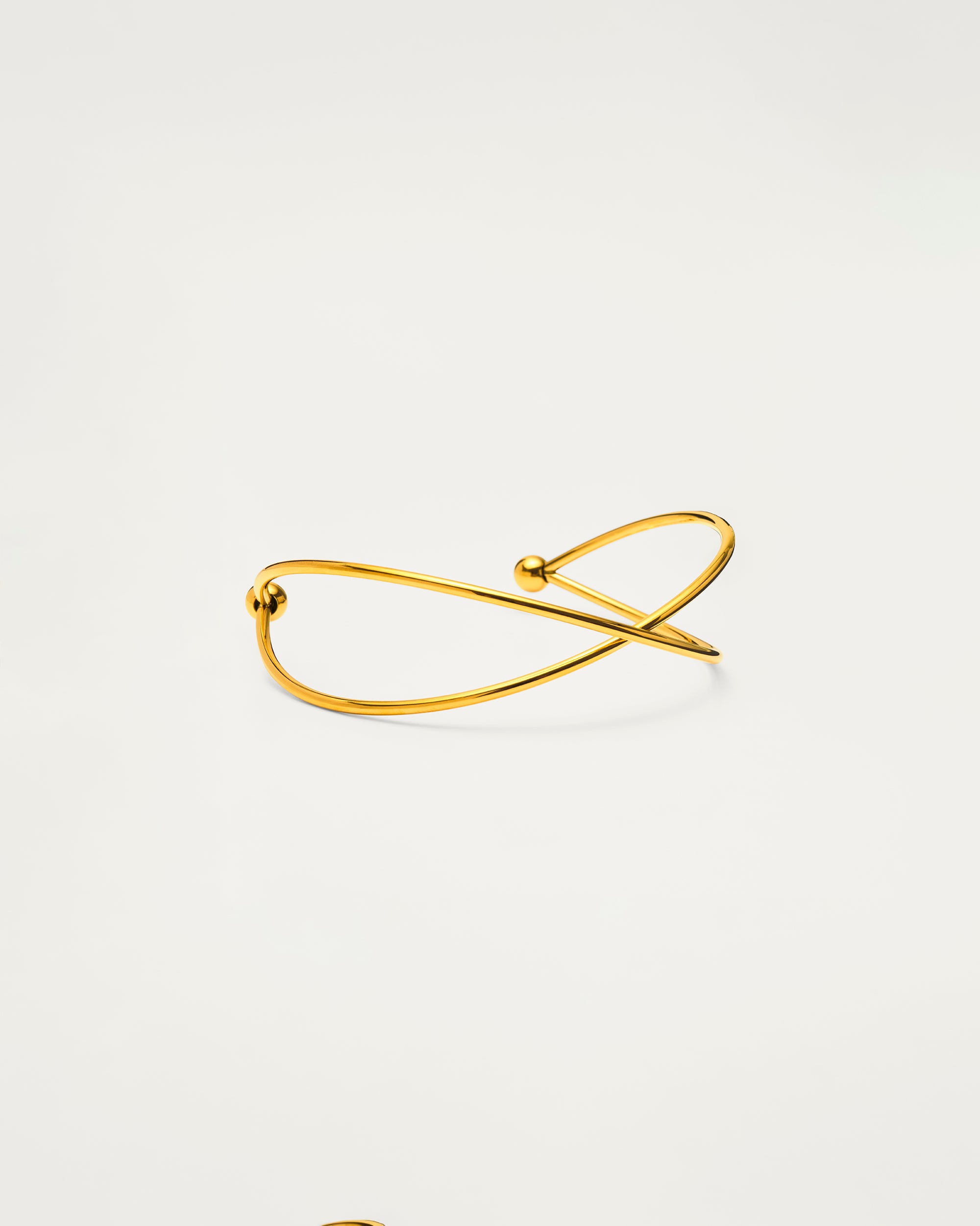 Gold Sculptural Cross Cuff Bangle